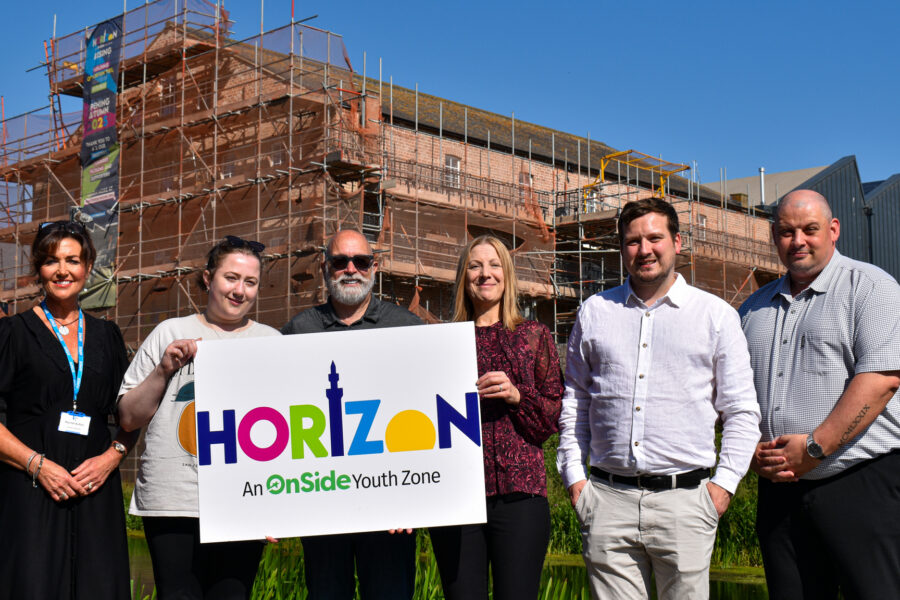 Staff members of Horizon Youth Zone and Humber Recruitment outside the building site