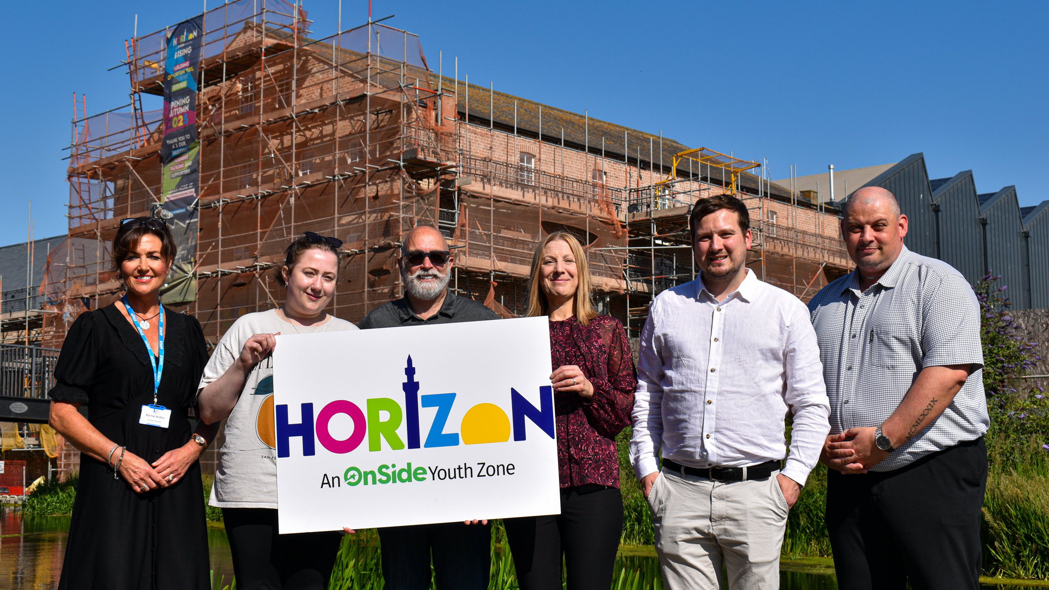 Staff members of Horizon Youth Zone and Humber Recruitment outside the building site