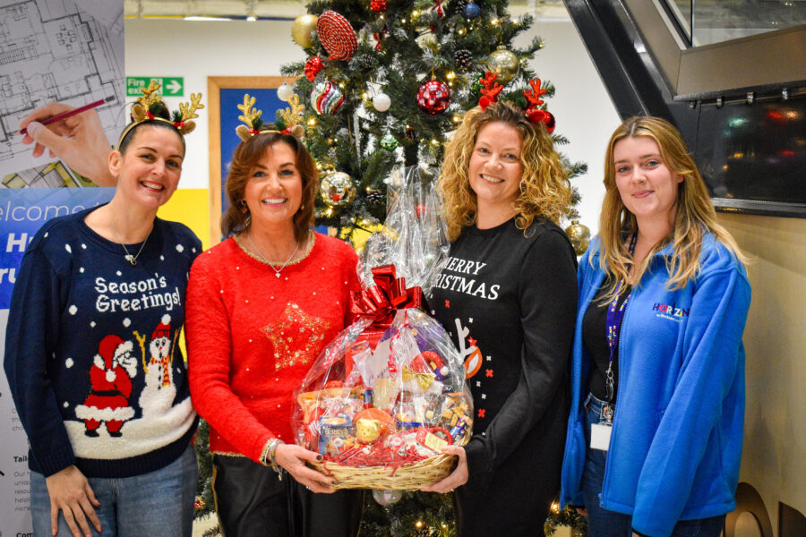 Members of the Humber Recruitment team with Horizon Youth Zone worker handing over Christmas hamper