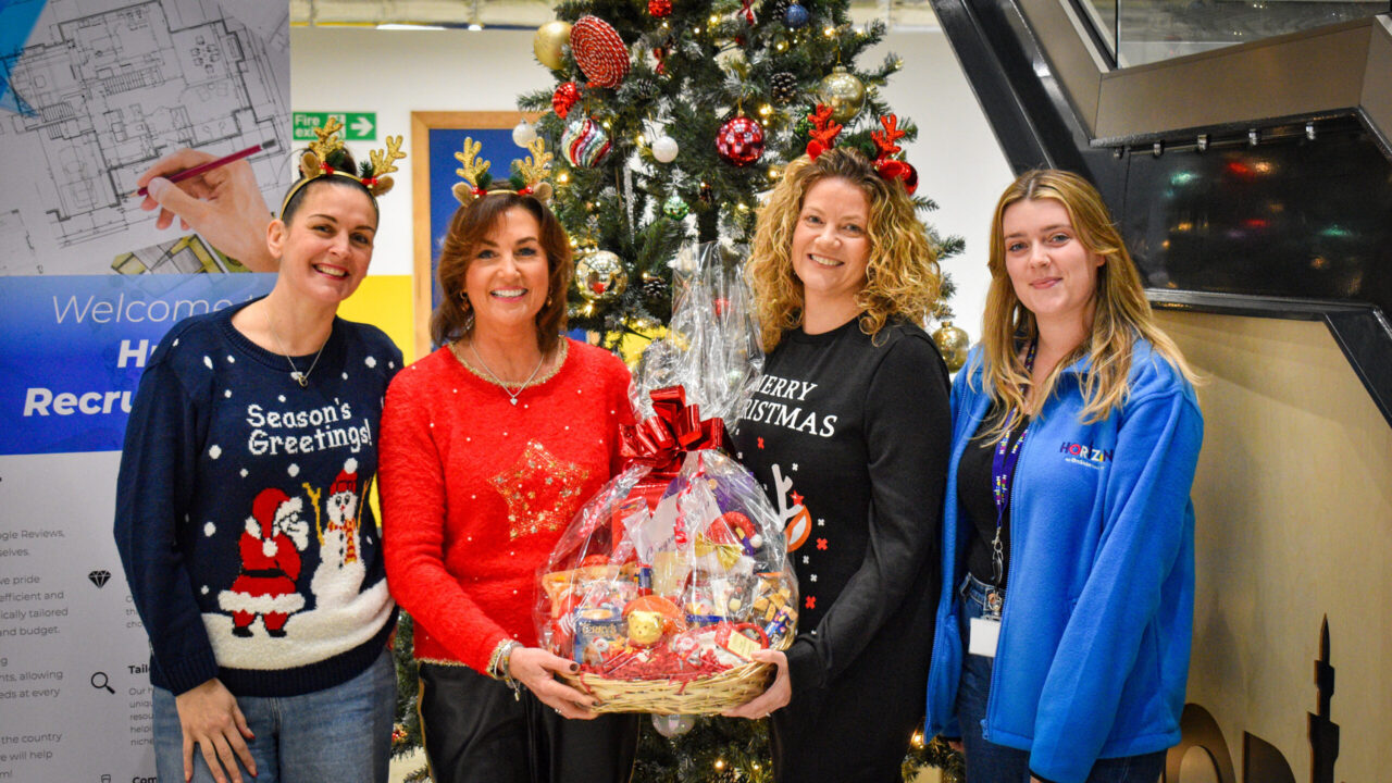 Members of the Humber Recruitment team with Horizon Youth Zone worker handing over Christmas hamper
